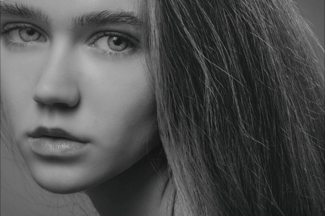 grayscale photography of long-haired woman