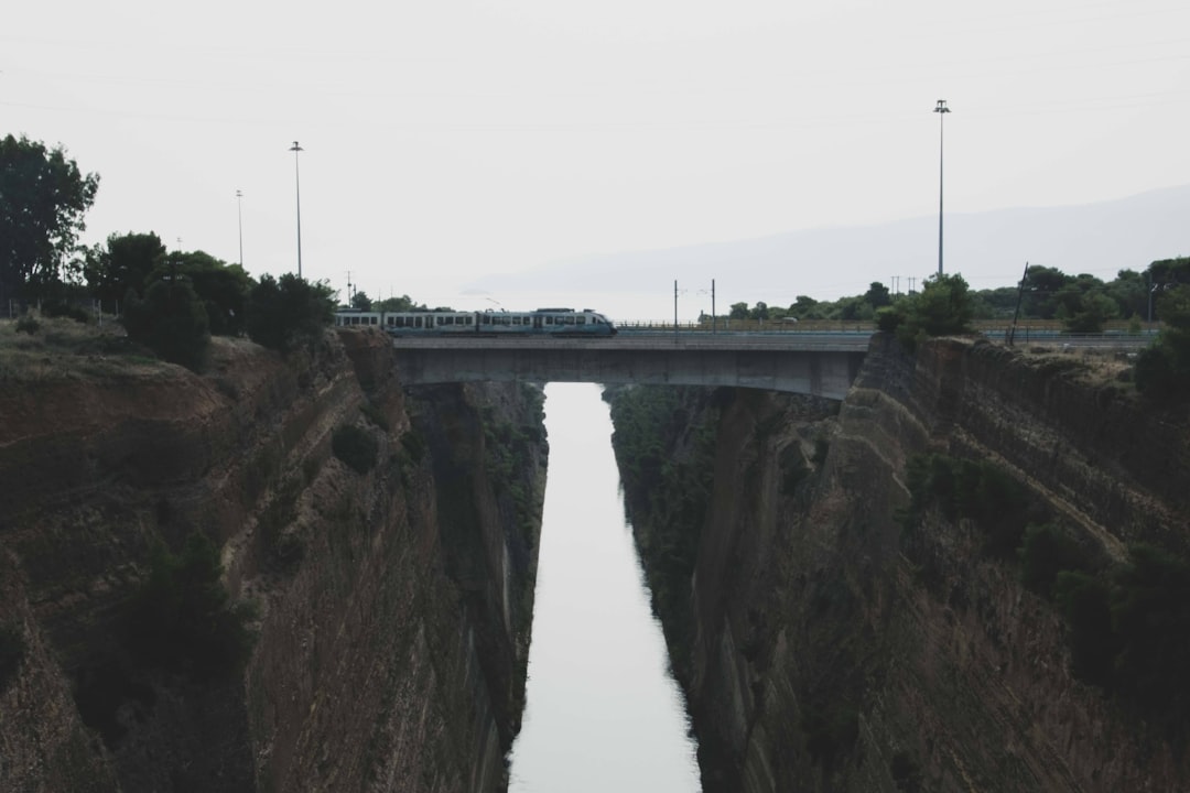 a train traveling over a bridge over a river