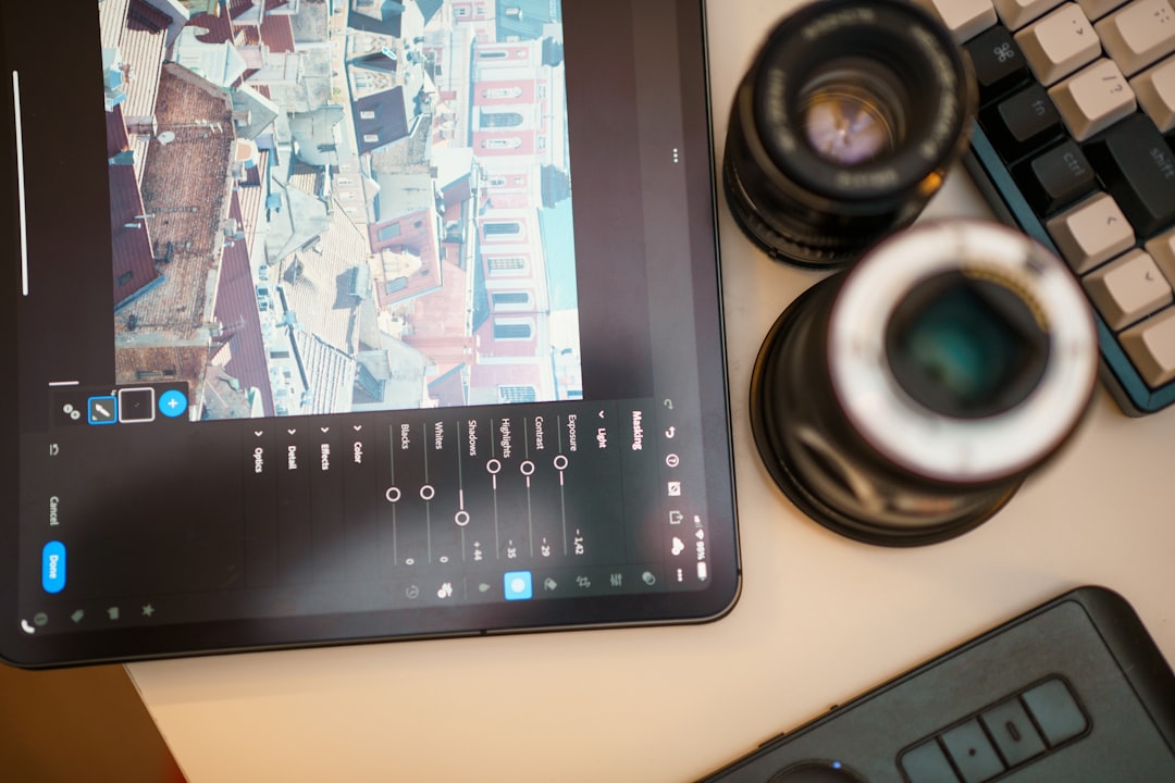 A tablet displays photo editing tools and other equipment.