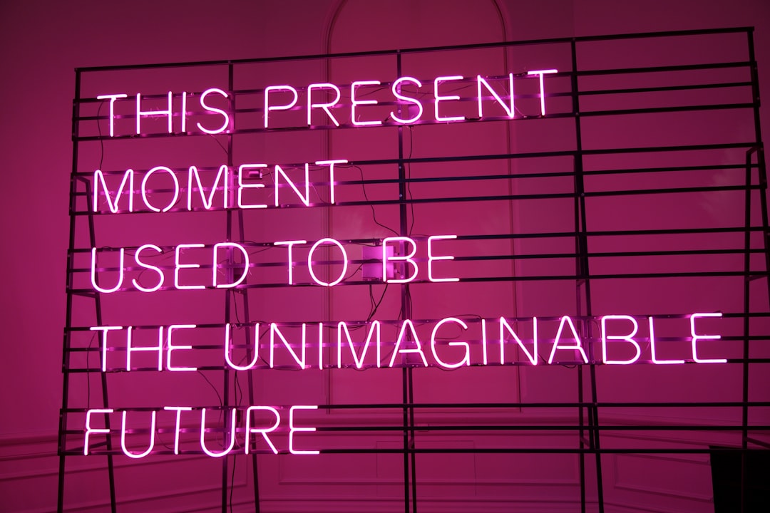 a neon sign that says this present moment used to be the unimaginable