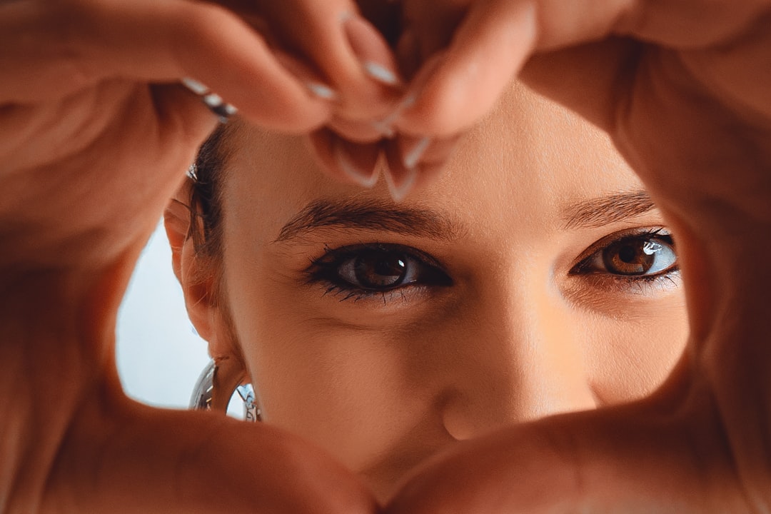 Woman framing her face with her hands