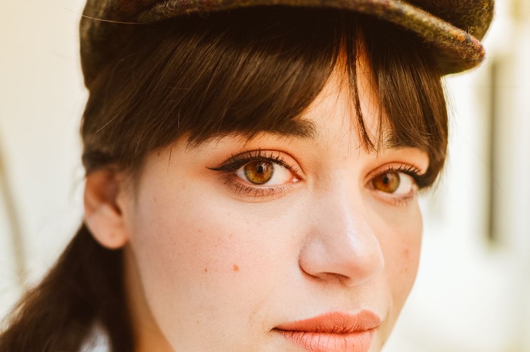 a close up of a person wearing wearing a hat