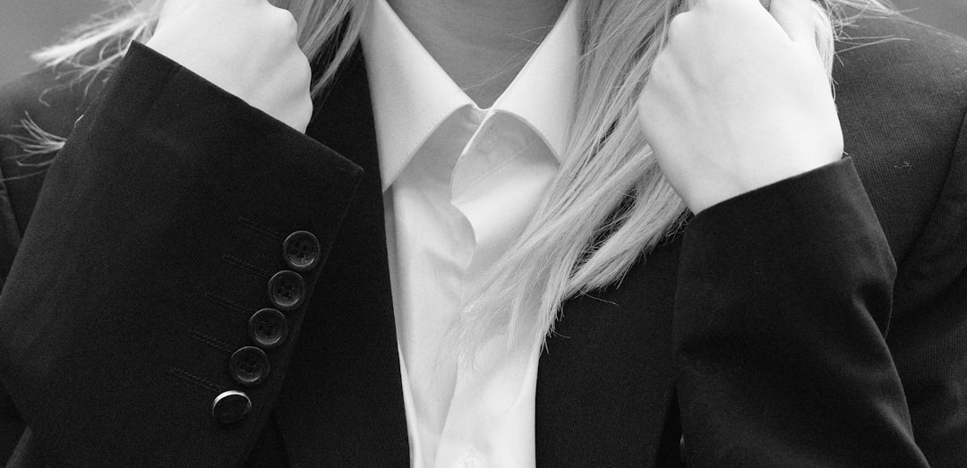 woman in black blazer and white dress shirt
