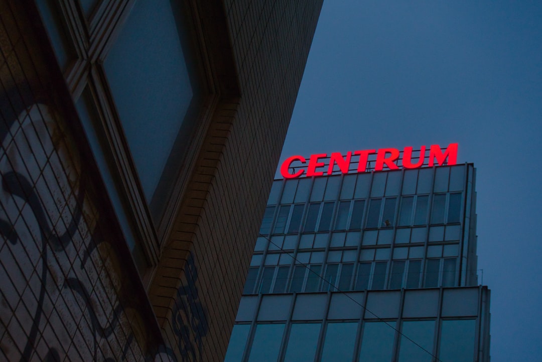 A tall building with a sign on top of it